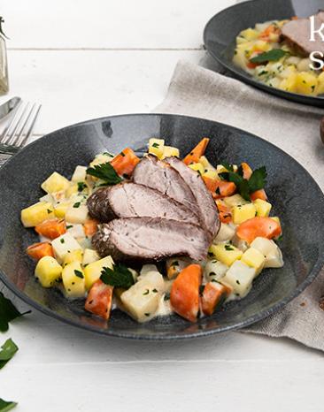 Zartes Schweinefilet mit cremigen Gemüseragout.