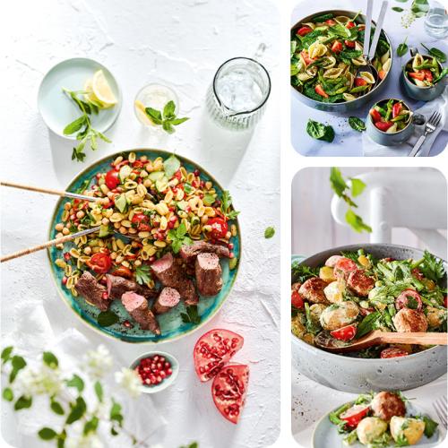 Bunte Salat in großen Schüsseln mit Salatbesteck